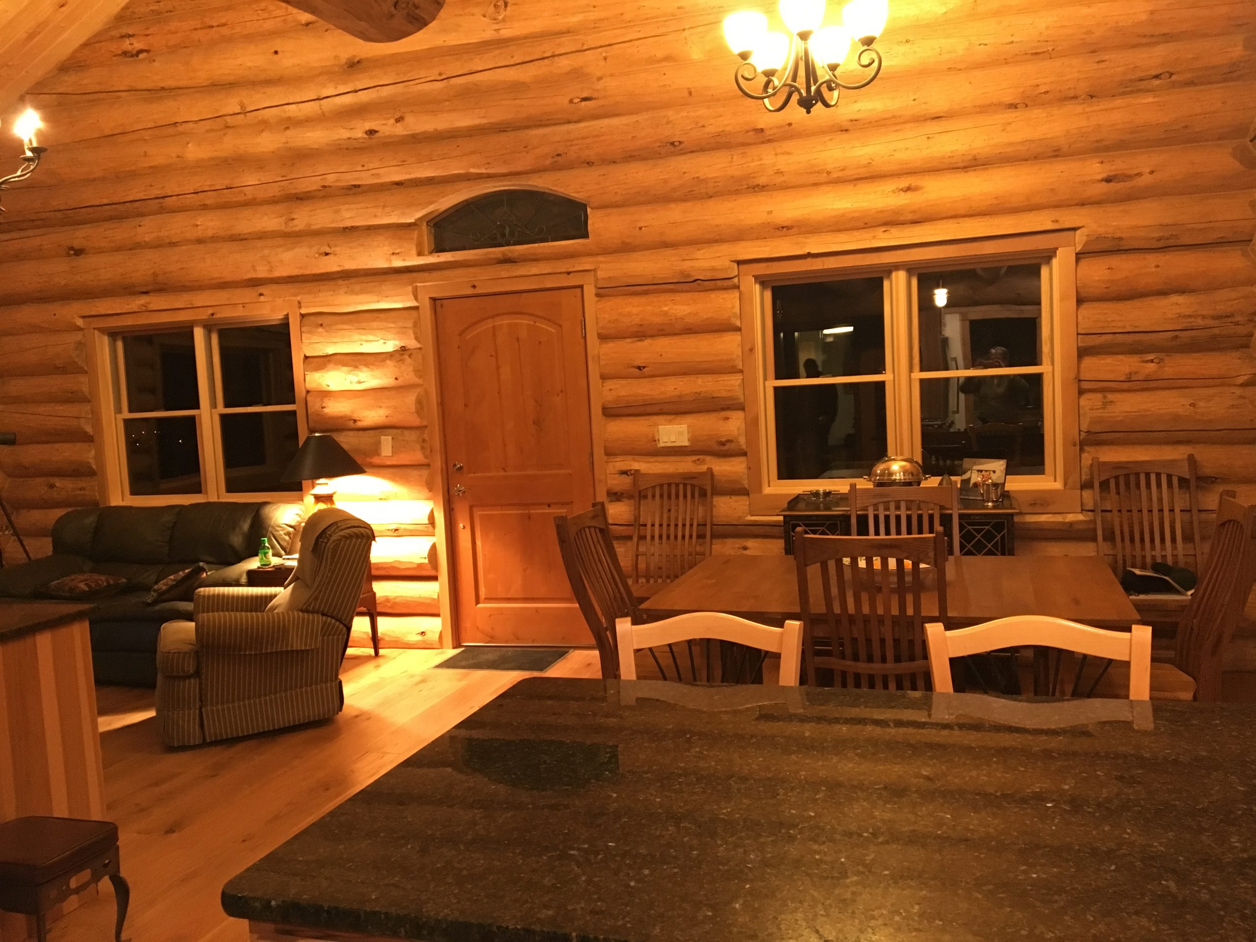 A great room area in a handcrafted log home.
