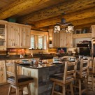 Log home kitchen with pine cabinets