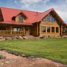 Exterior of custom log home with red roof