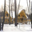 Exterior custom log home in winter