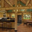 Kitchen and dining room in handcrafted log home
