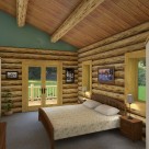 Master bedroom in handcrafted log home