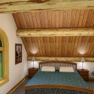 Interior log cabin loft bedroom