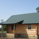 Exterior of small log cabin