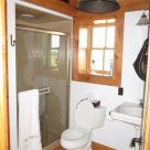bathroom with pedistal sink and glass shower