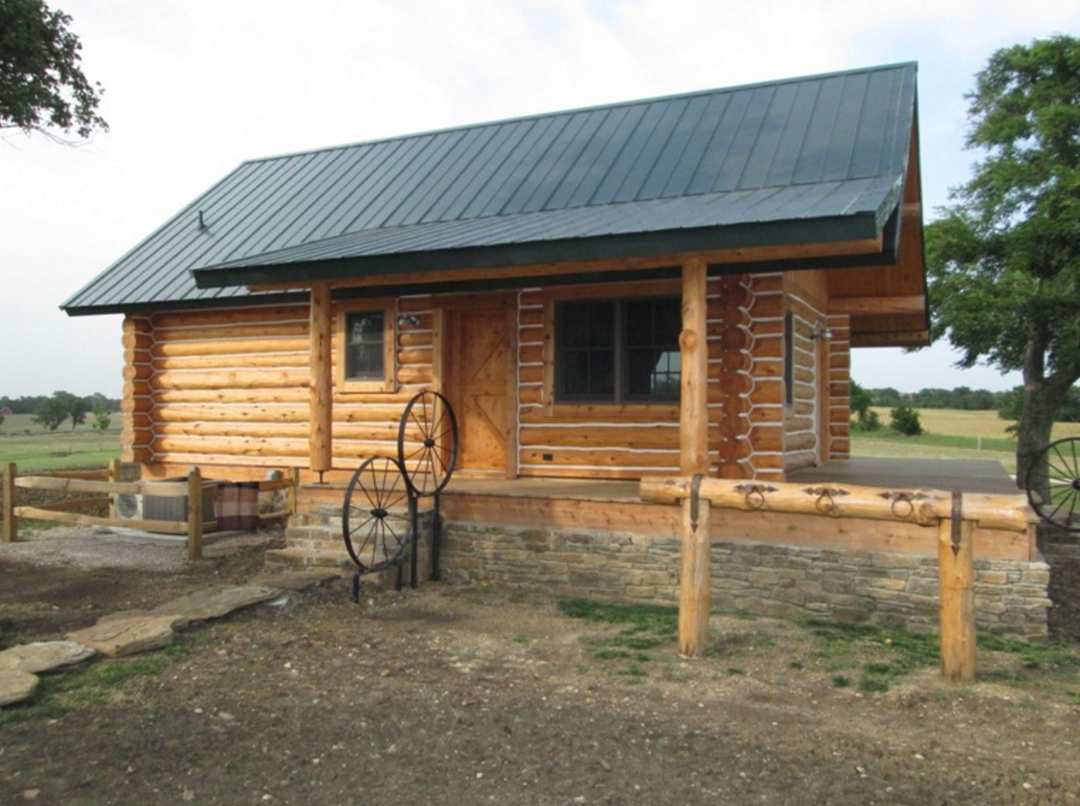 Exterior of log cabin with covered porch