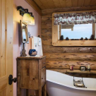 Clawfoot tub in bathroom of log home