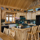 Log home kitchen with small island breakfast bar