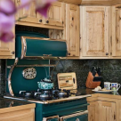 Wood cabinets around antique cook stove
