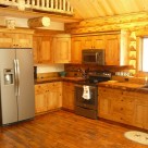 Kitchen in handcrafted log cabin