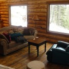 Living room in handcrafted log cabin