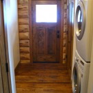 Mudroom in handcrafted log cabin