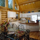 Kitchen and dining of handcrafted log home