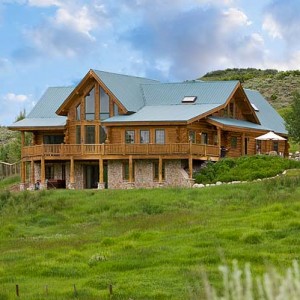 Exterior of handcrafted log home on walkout basement