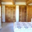 Bedroom in handcrafted log home