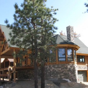 Exterior of log home on stone foundation