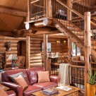 Photo of log staircase with mix of wood and steel railings.