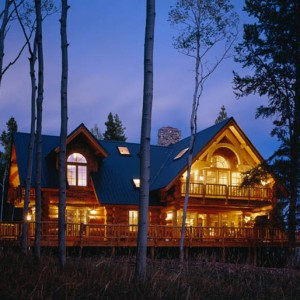 Handcrafted log home exterior at twilight