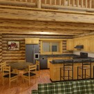 Rendering of custom log home kitchen with breakfast bar and dining table
