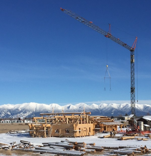 Tower cranes expedite the construction of several log homes in our Kalispell, MT log yard.