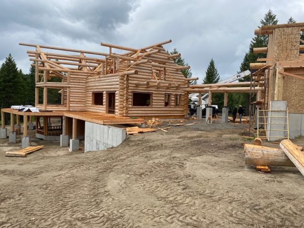 The stick framed garage will have log siding and pacman logs to tie in with the handcrafted log home.